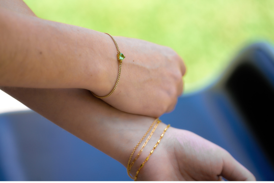 14k gold filled permanent bracelet on the young woman wrists